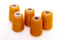 Orange spool of thread isolated on white background. Skein of woolen threads. Yarn for knitting. Materials for sewing Royalty Free Stock Photo