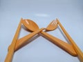 Orange spoon, fork and slanted