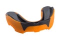 Orange sports mouth guard, protection of teeth in box of rubber on white background, isolate