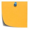 Orange square sticky note, with a blue pin, isolated Royalty Free Stock Photo