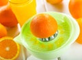 Orange squeezer with fresh fruits Royalty Free Stock Photo