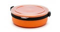 Orange stackable food container with clear lid and black strap Royalty Free Stock Photo