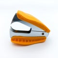 Orange Staple Remover Isolated On White Background. Side View On Square Orientation Royalty Free Stock Photo