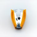 Orange Staple Remover Isolated On White Background. Up Facing View From Above Royalty Free Stock Photo