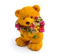 Orange statuette of a bear with flowers isolated on a white background