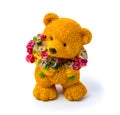 Orange statuette of a bear with flowers isolated on a white background