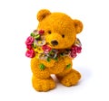 Orange statuette of a bear with flowers isolated on a white background