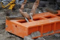 Orange steel beam tied with a steel chain