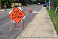 Orange steel plate on roadway construction sign Royalty Free Stock Photo