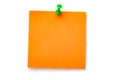 Orange sticker on green thumbtack Royalty Free Stock Photo