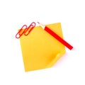 Orange sticky paper note with red clips and pencil Royalty Free Stock Photo