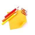 Orange sticky paper note with red clips and pencils Royalty Free Stock Photo