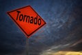 Orange storm road sign of tornado