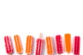 Orange and strawberry popsicles isolated on white background.. Royalty Free Stock Photo