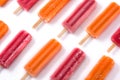 Orange and strawberry popsicles isolated on white background. Royalty Free Stock Photo