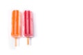 Orange and strawberry popsicles isolated on white background.. Royalty Free Stock Photo