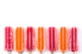 Orange and strawberry popsicles pattern isolated on white background. Royalty Free Stock Photo