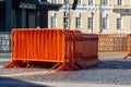 Mobile steel fence. orange street barriers to restrict movement before the concert