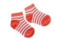 Orange striped baby socks on white background