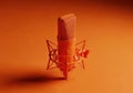 Orange studio microphone with shock mount isolated on white background Royalty Free Stock Photo