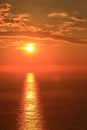 Orange sun with reflection Royalty Free Stock Photo