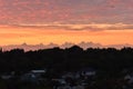 Orange sunrise cloudy sky over the park Royalty Free Stock Photo