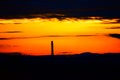 industrial chimney in orange sunrise light