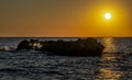 Orange sunrise over the rocky coast of the Mediterranean Sea Royalty Free Stock Photo