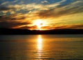 Orange sunset above a fjord