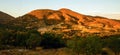 Orange sunset above inland hillside on island Lemnos.