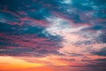 Orange sunset with blue and purple clouds Royalty Free Stock Photo