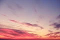 Orange sunset and clouds in the blue sky over the evening city, background Royalty Free Stock Photo