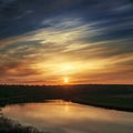 sunset in dramatic clouds over river Royalty Free Stock Photo