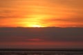 Orange sunset glow in sky over Morecambe Bay Royalty Free Stock Photo