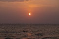 Orange sunset landscape with sea and red sun. Red orange sunset sky. Romantic evening seascape with sunset. Royalty Free Stock Photo