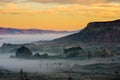 Orange sunset and mystical fog over the Cappadocia, Turkey