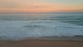 Orange sunset ocean horizon over foamy waves aerial view. Surf rolling coast Royalty Free Stock Photo