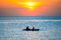 Sunset over sea and silhouette of kayak Royalty Free Stock Photo