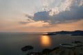 Orange sunset over the mountains and the island of Sveti Stefan. Montenegro Royalty Free Stock Photo