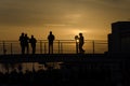 Orange sunset over pedestrian bridge Royalty Free Stock Photo