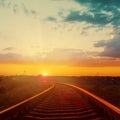 Orange sunset over railroad to horizon Royalty Free Stock Photo