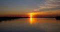 Orange sunset over the river on a summer evening Royalty Free Stock Photo