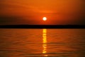 Orange sunset over water and sun track background image Royalty Free Stock Photo