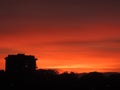 Orange sunset with the shadow of a building Royalty Free Stock Photo