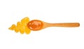 Orange sweet and sour sauce in small wooden spoon isolated on white background,top view Royalty Free Stock Photo