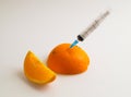 Orange with syringe