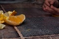 Orange on the table.Child holding a fruit Royalty Free Stock Photo