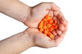 Orange tablets in children's palms