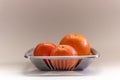 Orange tangerine basket in a plain grey background Royalty Free Stock Photo