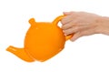 Orange teapot isolated in hand on white background Royalty Free Stock Photo